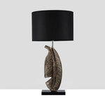 Load image into Gallery viewer, Cayo Table Lamp – Gold Feather &amp; Black Marble, Luxurious Elegance | Chal Decoration

This highlights the lamp’s intricate details, premium materials, and warm, sophisticated ambiance, making it ideal for luxury settings.
