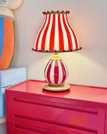 Load image into Gallery viewer, Circus-Themed Table Lamp – Red and White Stripes, Playful and Nostalgic Design | Chal Decoration

This highlights the lamp&#39;s vibrant, carnival-inspired design, blending nostalgia and modern elegance, while emphasizing its joyful and energetic atmosphere.
