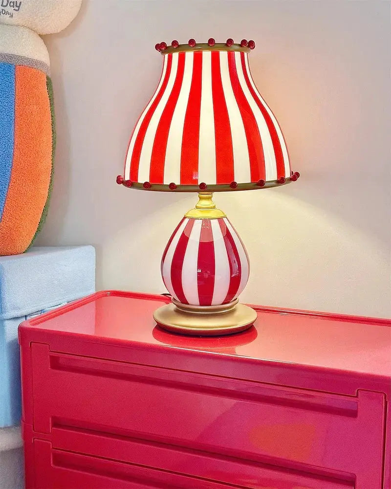 Circus-Themed Table Lamp – Red and White Stripes, Playful and Nostalgic Design | Chal Decoration

This highlights the lamp's vibrant, carnival-inspired design, blending nostalgia and modern elegance, while emphasizing its joyful and energetic atmosphere.