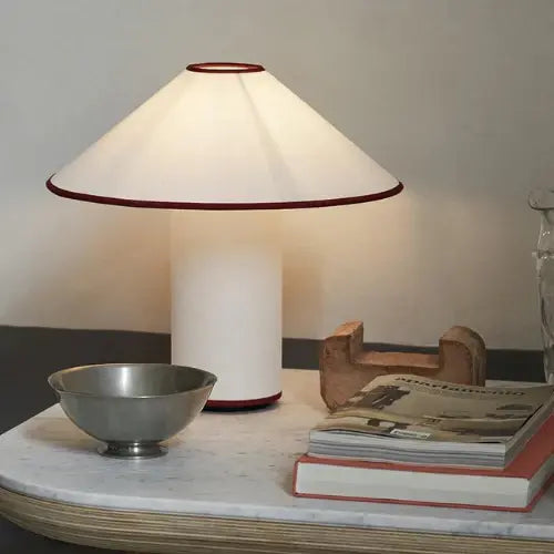 Colette Table Lamp – Conical Fabric Shade, Contemporary Vintage Charm | Chal Decoration

This highlights the lamp’s blend of modern and vintage aesthetics, emphasizing its warm illumination and stylish, balanced design.