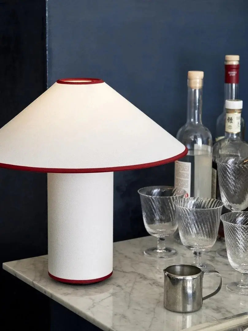 Colette Table Lamp – Conical Fabric Shade, Contemporary Vintage Charm | Chal Decoration

This highlights the lamp’s blend of modern and vintage aesthetics, emphasizing its warm illumination and stylish, balanced design.