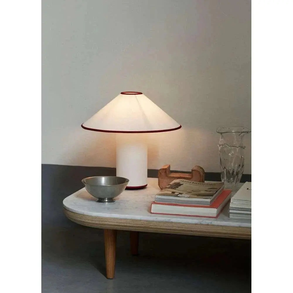 Colette Table Lamp – Conical Fabric Shade, Contemporary Vintage Charm | Chal Decoration

This highlights the lamp’s blend of modern and vintage aesthetics, emphasizing its warm illumination and stylish, balanced design.