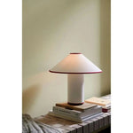 Load image into Gallery viewer, Colette Table Lamp – Conical Fabric Shade, Contemporary Vintage Charm | Chal Decoration

This highlights the lamp’s blend of modern and vintage aesthetics, emphasizing its warm illumination and stylish, balanced design.
