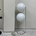 Load image into Gallery viewer, This emphasizes the sleek chrome frame and the futuristic design of the floating orbs, highlighting the lamp&#39;s modern and stylish appeal.
