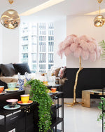 Load image into Gallery viewer, pink Ostrich Feather Brass Floor Lamp in a living room
