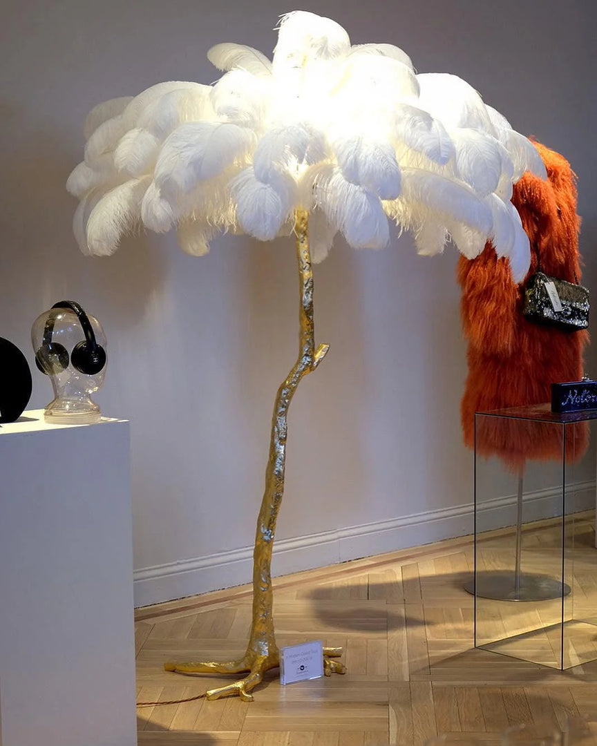 displayed white Ostrich Feather Brass Floor Lamp in a store 