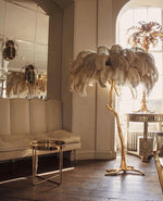 Load image into Gallery viewer, beige Ostrich Feather Brass Floor Lamp in a living room
