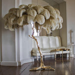 Load image into Gallery viewer, beige Ostrich Feather Brass Floor Lamp in a living room
