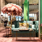 Load image into Gallery viewer, pink Ostrich Feather Brass Floor Lamp in a living room
