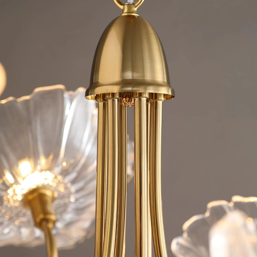 Close-up of the Oleander floral chandelier showing its elegant gold fixture and delicate, clear glass flower-shaped shade, highlighting the craftsmanship and luxurious design. Pendant Lamp