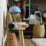 Load image into Gallery viewer, A blue rechargeable LED small desk lamp rests on a wooden table, next to a stack of books titled &quot;School&quot; in Dutch. The lamp stands beside a woven basket, and a child’s legs can be seen standing near a bed in the background. The room has a cozy, personal vibe, with soft natural light illuminating the items in the foreground.
