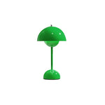 Load image into Gallery viewer, A vibrant green rechargeable LED small desk lamp stands against a white background. The sleek, modern design features a round base and a semi-spherical lampshade, showcasing a clean, minimalistic look.
