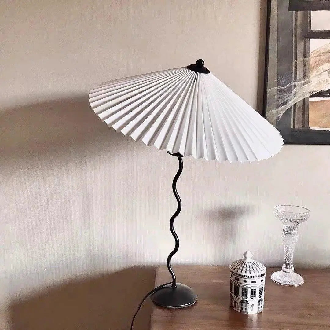 Squiggle Table Lamp – Origami-Folded Shade, Modern & Sophisticated Design | Chal Decoration

This highlights the lamp’s unique folded design, wavy base, and its blend of contemporary elegance with strong personality.