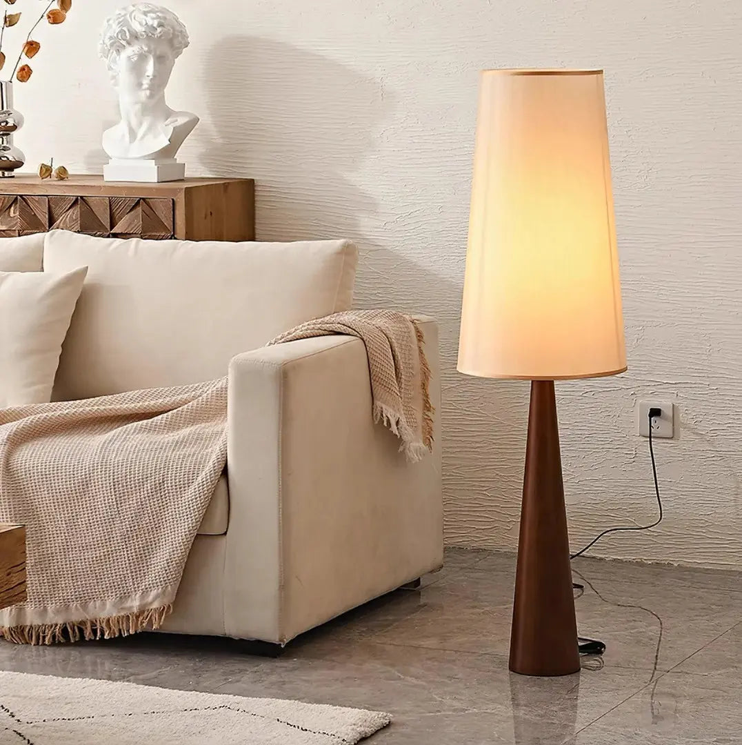 This highlights the lamp’s sleek wooden design and minimalist sophistication, emphasizing its warmth and contemporary appeal.