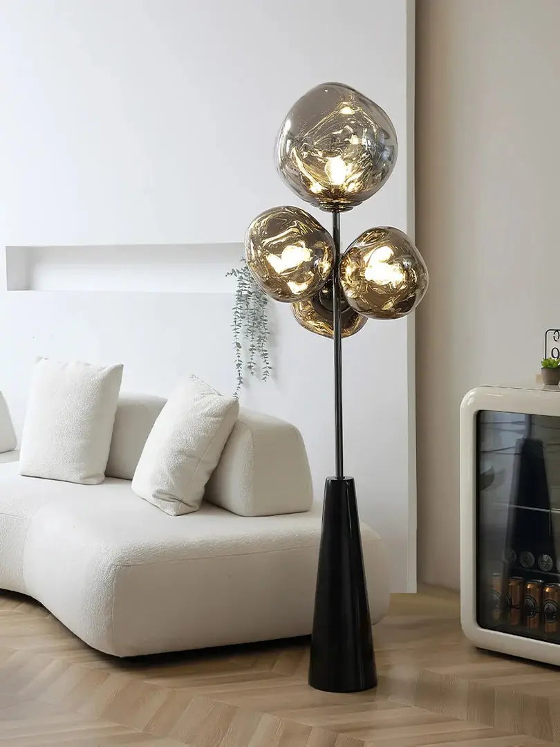 This highlights the lamp’s unique blown glass construction and its modern, optical effect, emphasizing its artistic and sophisticated appeal.