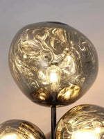 Load image into Gallery viewer, This highlights the lamp’s unique blown glass construction and its modern, optical effect, emphasizing its artistic and sophisticated appeal.
