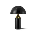 Load image into Gallery viewer, Atollo metal table lamp with a glossy black dome-shaped shade and cylindrical base, shown on a white background with light reflecting from the interior for a sleek and minimalist design.
