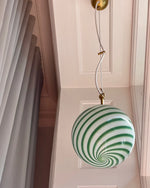 Load image into Gallery viewer, Green and white striped candy pendant lamp hanging in a stylish room with soft curtains and light-colored walls, casting a playful and vibrant glow to enhance the modern interior design.
