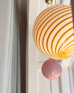 Load image into Gallery viewer, Candy pendant lamp with pink and orange swirl design, creating a charming focal point in any room with its vibrant, playful aesthetic, offering a unique touch to the space.
