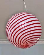 Load image into Gallery viewer, This vibrant Candy pendant lamp with red and white stripes hanging from the ceiling creates a visually striking atmosphere in the space, complementing the surrounding decor with its playful design.
