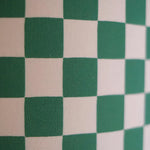 Load image into Gallery viewer, A close-up view of a bold green and white checker pattern, showcasing the texture and weave of the fabric. The crisp, contrasting squares create a dynamic visual effect, highlighting the classic yet playful design perfect for modern decor elements such as lampshades or upholstery.
