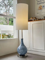 Load image into Gallery viewer, This highlights the lamp’s coastal charm, versatile design, and warm, balanced lighting.
