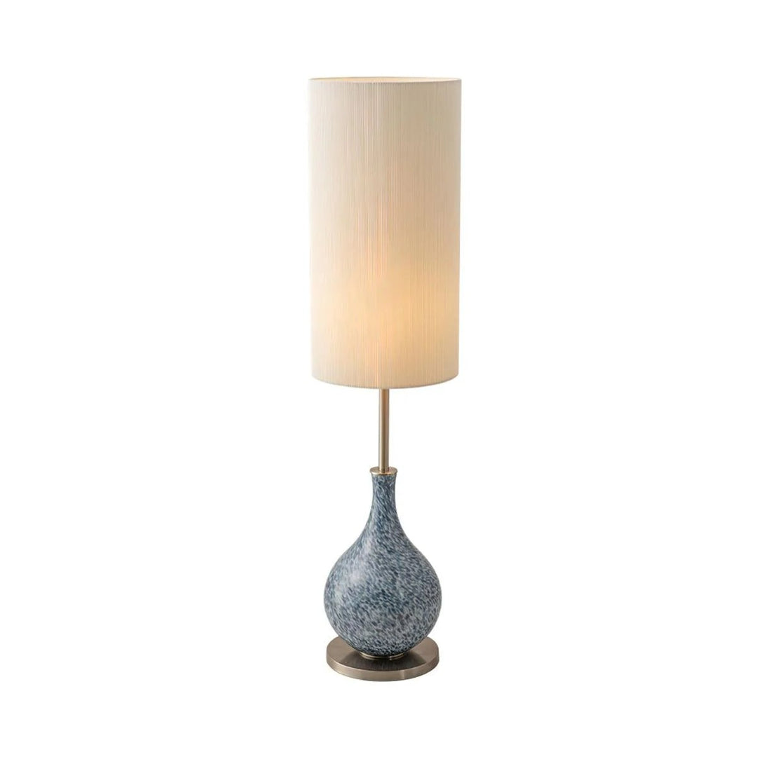 This highlights the lamp’s coastal charm, versatile design, and warm, balanced lighting.