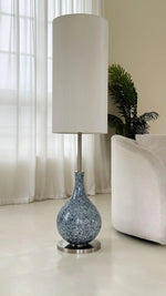 Load image into Gallery viewer, This highlights the lamp’s coastal charm, versatile design, and warm, balanced lighting.
