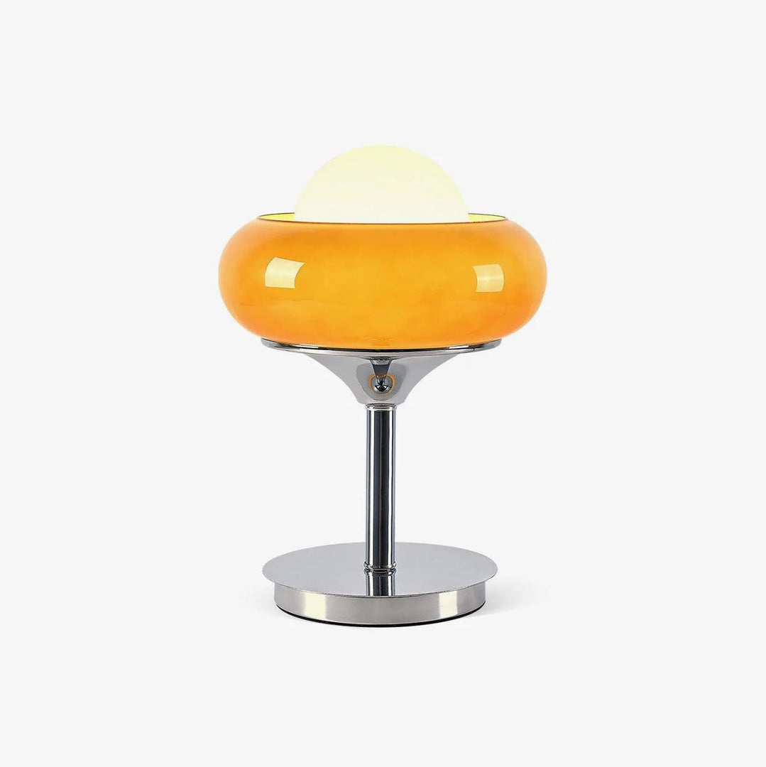 Front-facing product shot of the Crostata Table Lamp featuring a glowing white orb encased in a bold orange glass bowl with a polished chrome base, isolated on a clean white background for a minimalist presentation.