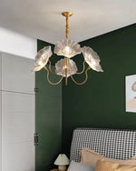 Load image into Gallery viewer, The crystal floral chandelier with delicate glass petals and a gold frame adds a refined touch to a stylish bedroom, complementing the deep green accent wall, houndstooth-patterned headboard, and cozy neutral bedding, creating a sophisticated yet warm ambiance.
