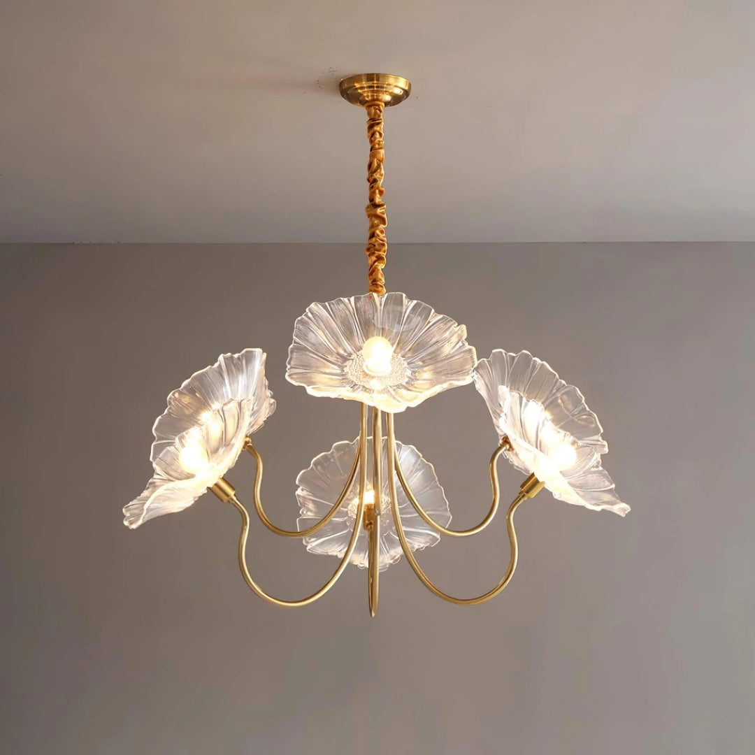 Elegantly crafted, this pendant lamp features crystal-clear floral shades and a golden frame, casting a radiant glow that accentuates its delicate petal-like forms and luxurious appearance, ideal for sophisticated and refined interior settings.