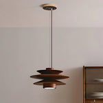 Load image into Gallery viewer, Cylindrical Pendant Light with a layered design in a warm brown finish, suspended from the ceiling in a contemporary room, complementing minimalist decor with soft lighting and wooden furniture accents.
