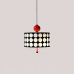 Load image into Gallery viewer, A sleek Metal Lattice Pendant Lamp featuring a striking black shade adorned with white circles, accented with red connectors, creating a bold and contemporary visual against a neutral backdrop.
