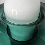 Load image into Gallery viewer, Close-up detail of the green glass table lamp, showcasing the glowing white dome top and the smooth, transparent gradient glass surface with subtle reflections.
