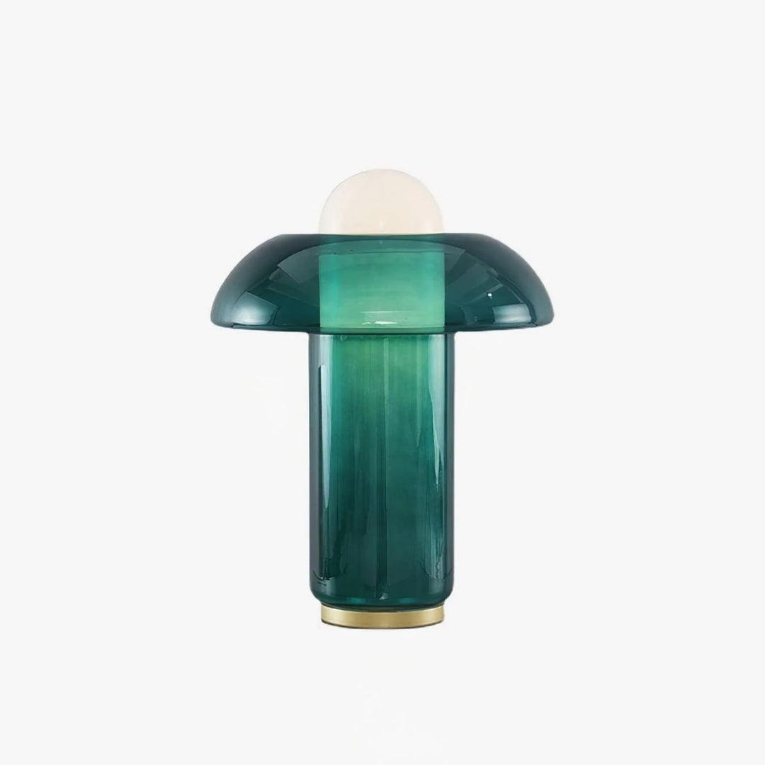 Green glass table lamp with a dome-shaped top, gradient glass base, and a gold accent, isolated on a white background for a clean, minimalist presentation.