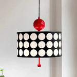 Load image into Gallery viewer, Contemporary metal lattice pendant lamp with a black shade featuring large white circles and a vibrant red top and bottom accent, elegantly displayed against a soft background.
