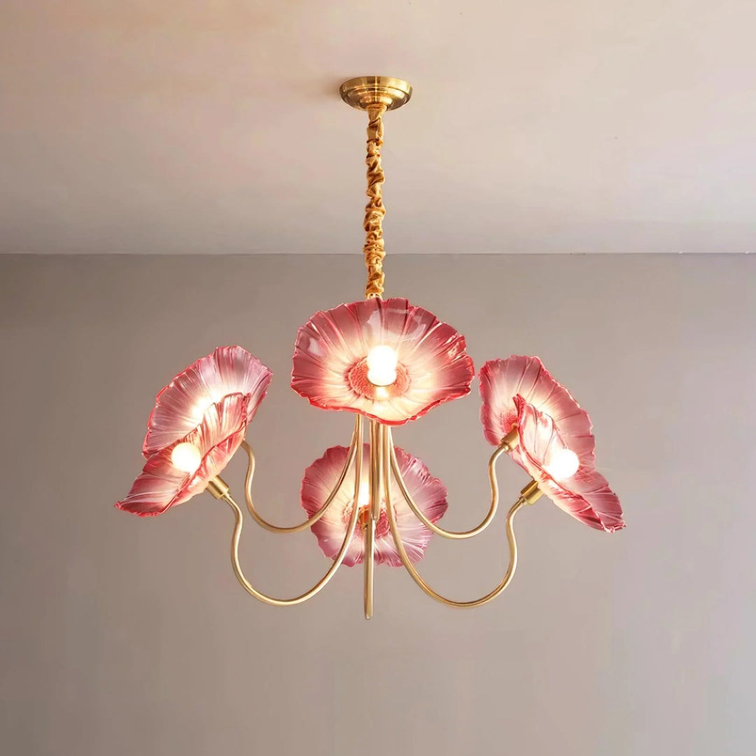 The Oleander Pendant Lamp, featuring golden rods and radiant pink oleander-shaped shades, casts a warm, inviting glow, enhancing the aesthetic appeal with its floral-inspired design and sophisticated charm, perfect for adding a touch of natural beauty to any room.