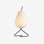 Load image into Gallery viewer, Minimalist view of a pear-shaped floor lamp with vertical stripes, featuring a black curved tripod stand, isolated against a white background.
