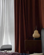 Load image into Gallery viewer, A close-up view of a glowing pear-shaped lamp sitting on a dark wooden dresser, set against rich burgundy curtains and sheer white drapes, adding an ambient touch to the cozy room decor.
