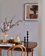 Load image into Gallery viewer, A pear-shaped table lamp placed on a wooden dining table alongside decor elements such as a branch arrangement in a vase, geometric candlesticks, and a coffee set, creating a cozy and artistic dining space.
