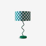 Load image into Gallery viewer, checkerboard-table-lamp-isolated  
An isolated image of a Checkerboard Table Lamp with a green and white checkered shade and a whimsical spiral green base, displayed against a clean white background. The lamp&#39;s playful yet minimalist design makes it a standout decor piece ideal for adding a pop of color and personality to any modern interior.
