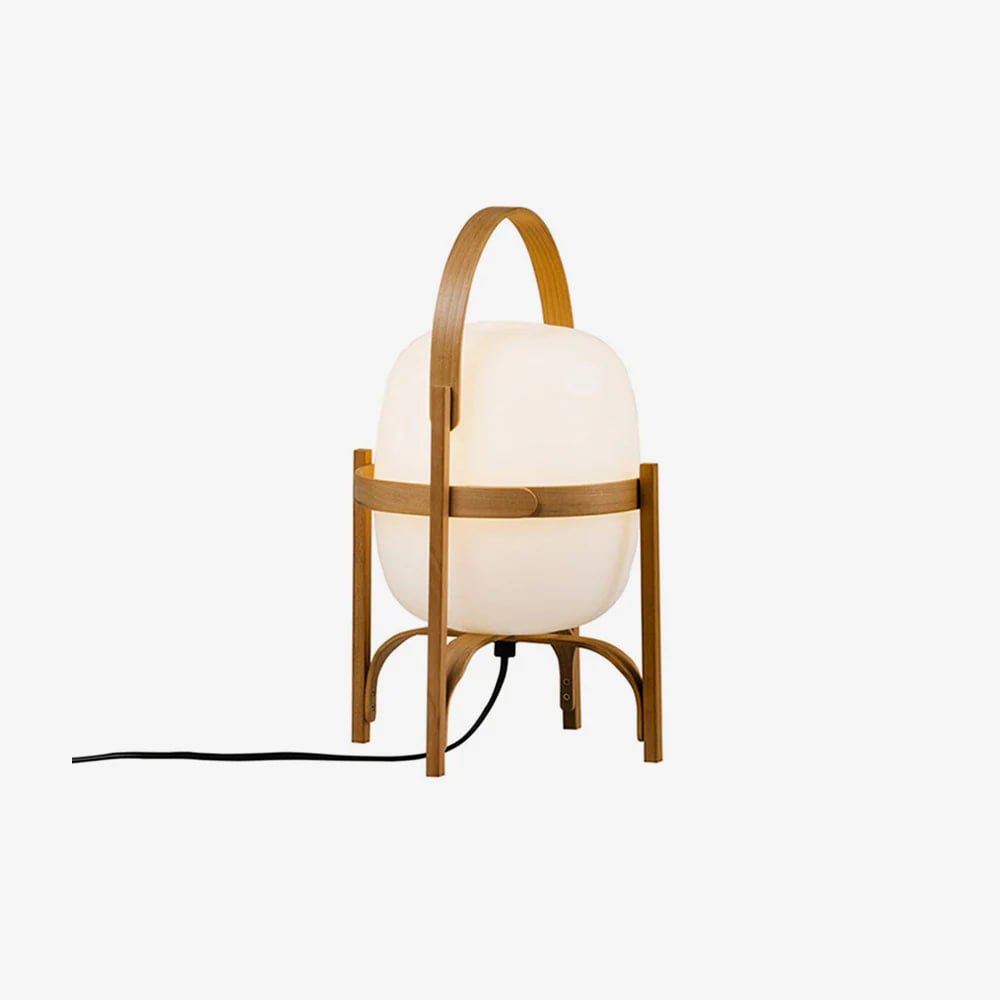 Portable lantern-style glass lamp with a warm glow, featuring a sleek wooden frame, leather handle, and black cord, isolated on a white background to showcase its modern design.