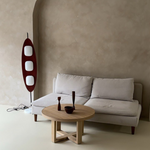 Load image into Gallery viewer, A Surfboard Floor Lamp with a wooden frame and three illuminated panels, styled next to a light gray sofa and a round wooden coffee table with minimal decor, in a serene neutral-toned living room.
