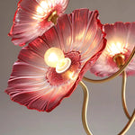 Load image into Gallery viewer, Close-up of a pendant lamp showcasing vibrant pink floral shades, each petal meticulously crafted to reflect light beautifully. The rich textures and golden hues within the lamp create a dynamic and luxurious effect, perfect for enhancing the decor with a touch of nature-inspired artistry.
